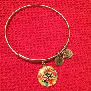 Alex and Ani gold bracelet with colorful charm